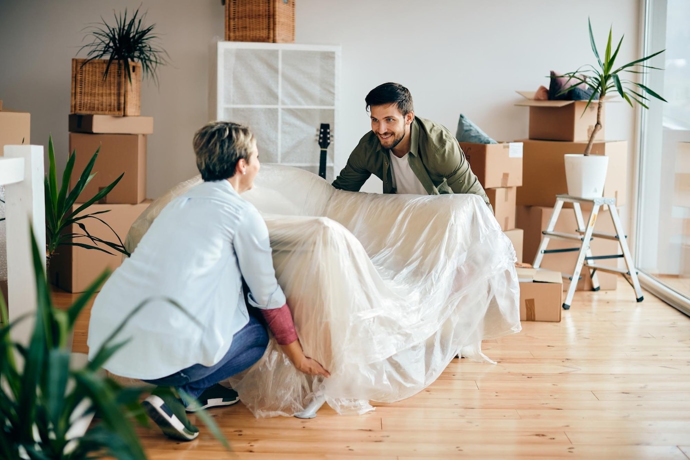 happy-couple-moving-into-their-n