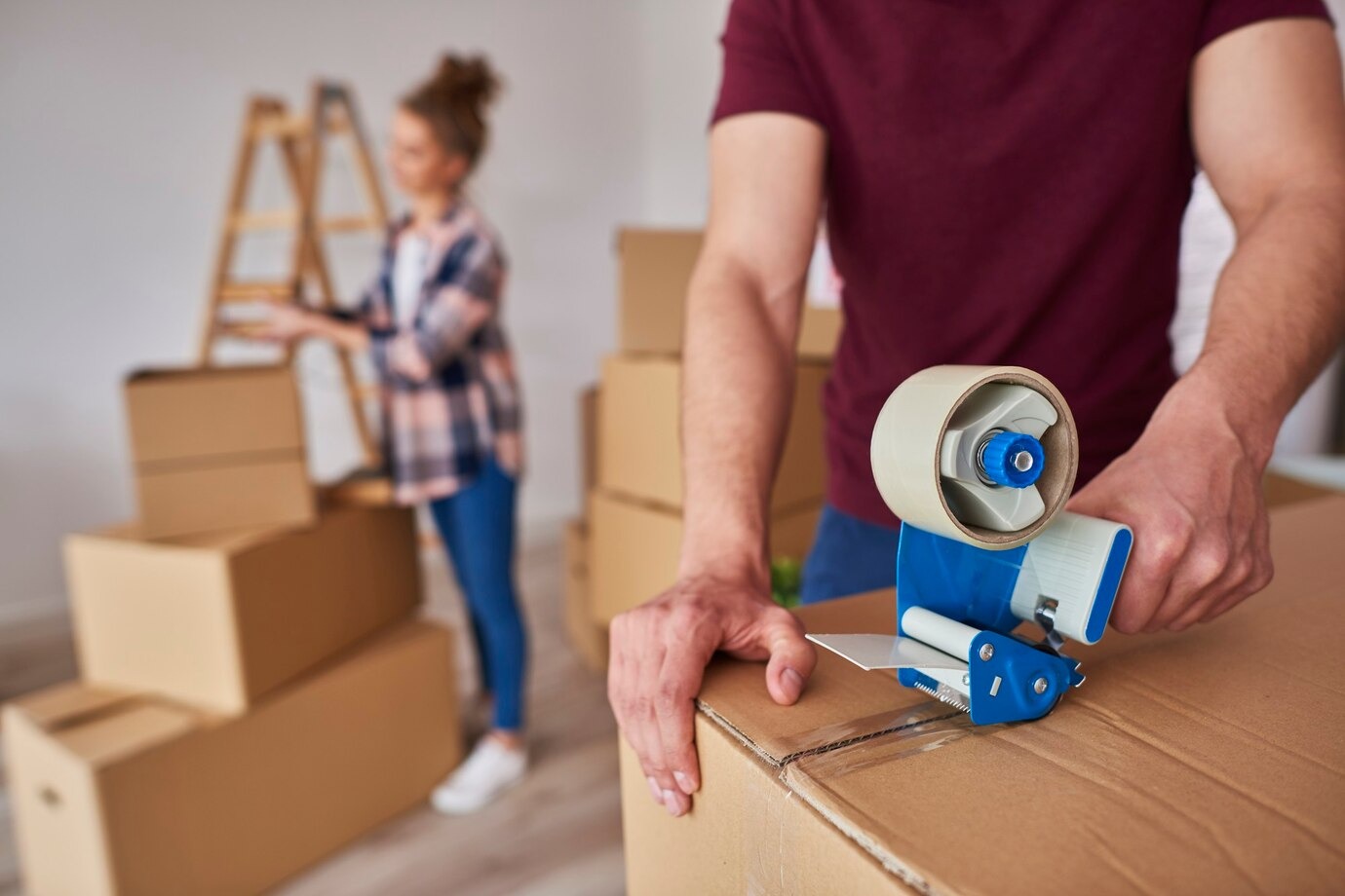 man-with-adhesive-tape-packing-b